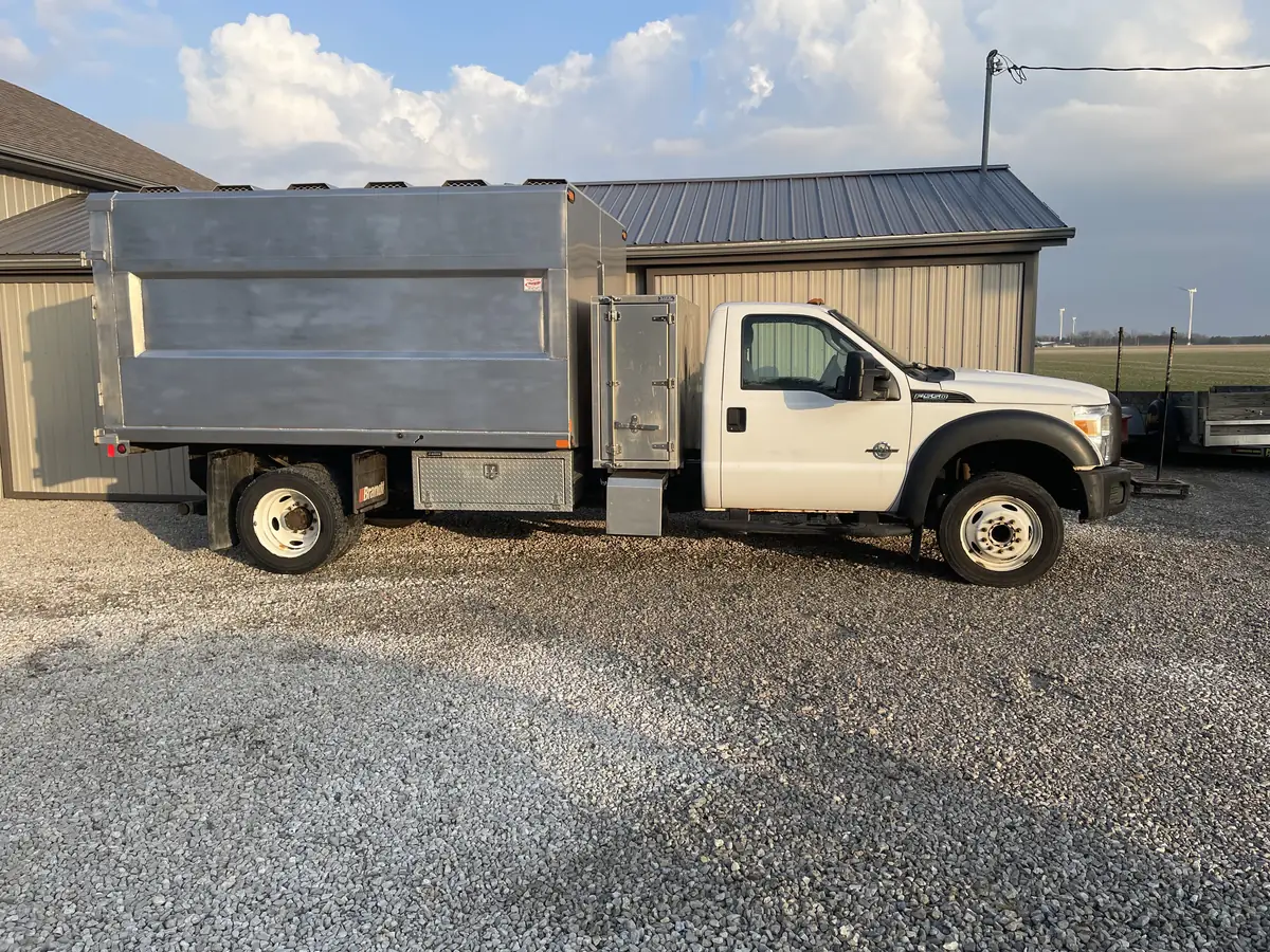 Sparks Tree Care Ford F-550 chip truck with its aluminium chip box, parked on gravel